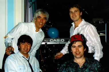 Original line-up - circa 1990; Standing: Graham le Poidevin, Darius Rowland; Sitting: Tim Millard, Lloyd Munro
